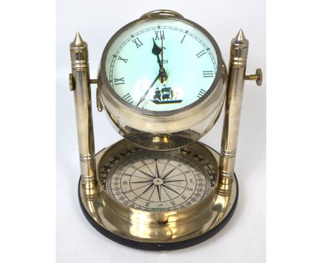 A contemporary chromed decorative combination table ship's clock/compass.