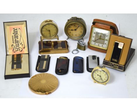 A small collector's lot to include a Stratton compact, various Ronson lighters, three small vintage alarm clocks to include H