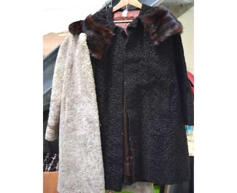 Two vintage fur coats; a lamb coat and an Astrakhan coat with mink collar.