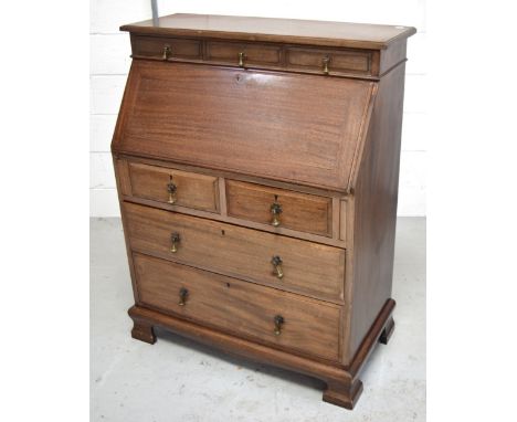 A 20th century mahogany bureau on ogee bracket feet, width 91cm.