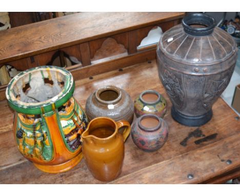 Various stoneware and ceramic baluster vases to include a large ovoid majolica example, a large brown baluster vase with flow