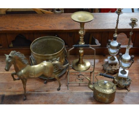 A collection of brassware to include a large model of a horse, a jardinière, a spirit kettle, two brass and ceramic candle ho