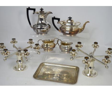 A Mappin & Webb plated four part tea service comprising a teapot, hot water jug, sugar bowl and milk jug, a plated rectangula