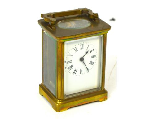 A French brass carriage clock, the dial set with Roman numerals, marked to the back inside the glass door 'R&Co Made in Paris