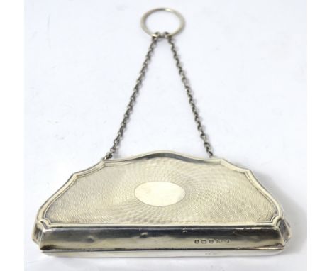 A George V hallmarked silver engine turned purse with chain handle, three compartments to interior, lined in emerald green si