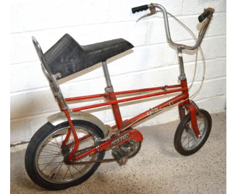 A vintage Raleigh Tomahawk red painted child's bicycle.