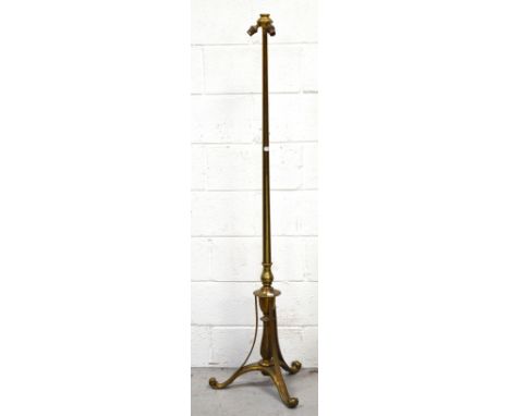 An early 20th century brass triple light standard lamp on trefoil support height 150cm.