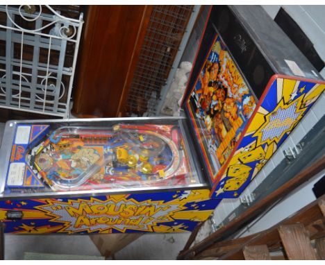 A retro late 1980s Bally 'Mousin' Around!' pinball machine produced by the Midway Manufacturing Company with operations and p