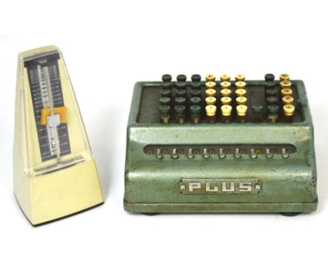 A Nikko metronome and a vintage adding machine (2).
