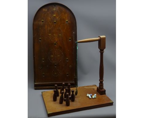 French 'House of Marbles' beech bar skittles game, the oblong base with turned support and nine self-righting turned skittles