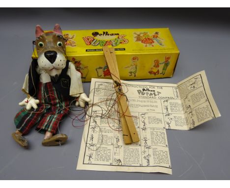 Pelham standard puppet of a Scottie dog in red bat, felt waistcoat and tartan trousers, boxed