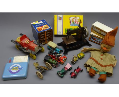 Two D&M RNLI die-cast model kits, boxed, continental child's tin-plate sewing machine, hand puppet of one of the seven dwarfs