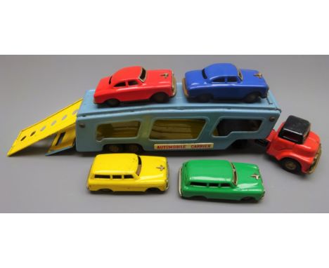 Japanese 1960s tin-plate  'Automobile Carrier', friction drive in blue/yellow/red/black with pull-out ramp to upper tier, con