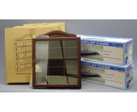 Four new wall mounting die-cast model display cases, each with mahogany stained finish and hinged 'perspex' door opening to a