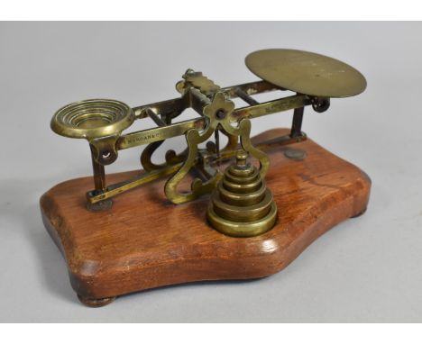 A Late Victorian Brass Postage Scale on Serpentine Shaped Plinth Base with Set of Graduated Weights, 19cms Wide 