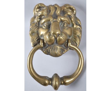 A Brass Lion Mask Door Knocker, 17cms High 