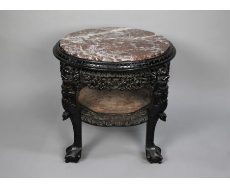 A Carved Hardwood Chinese Marble Top Circular Table having Stretcher Shelf, Also with Marble Panel, Four Claw and Ball Feet, 