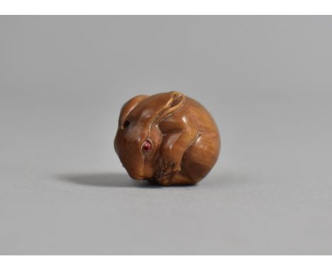 A Carved Wooden Netsuke in the Form of a Curled Rabbit, Signed, 2.5cm 