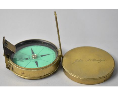 A Circular Brass Prismatic Compass, Lid Inscribed John S Bridges, Printed Green Inner Card for Baker of London 