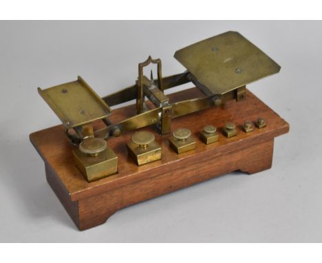 A Late Victorian Set of Brass Postage Scales with Graduated Weights Set on Mahogany Plinth Base, 25x12cms, Stamped E  Ratclif