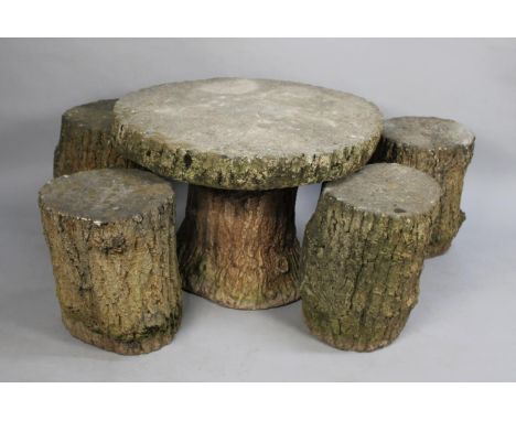 A Faux Bois Garden Table and Stool Set to Comprise Circular Table and Four Trunk Effect Stools 