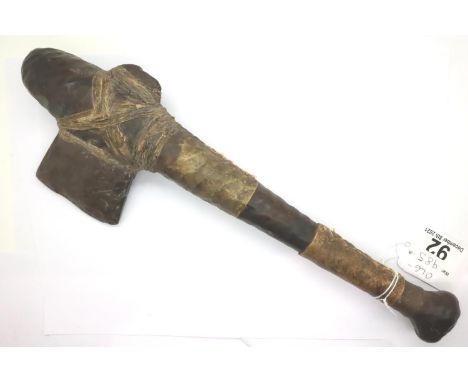 Late 19th/early 20th century Inuit seal club of multi piece construction with stone adze and vellum bound grip, L: 34 cm. Pro