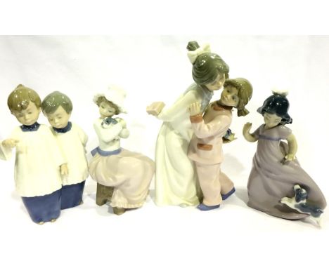 Two Nao figurines and two Nao figural groups, largest H: 22 cm (4). P&amp;P Group 3 (£25+VAT for the first lot and £5+VAT for