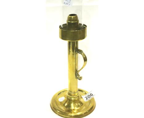 Victorian brass candlestick with a glass funnel, H: 26 cm (excluding funnel). P&amp;P Group 3 (£25+VAT for the first lot and 