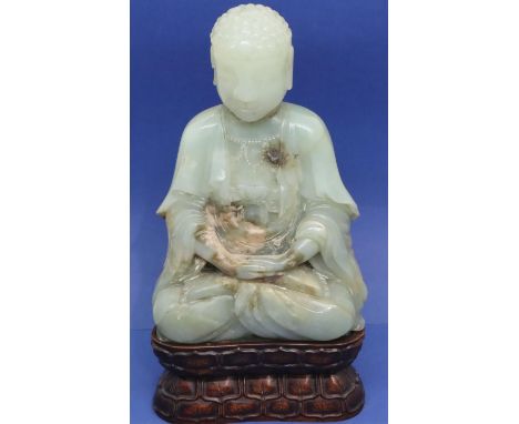Green jade seated Buddha on a later fitted stand with hands folded on lap with label to provenance (see image), H: 190 mm, sm
