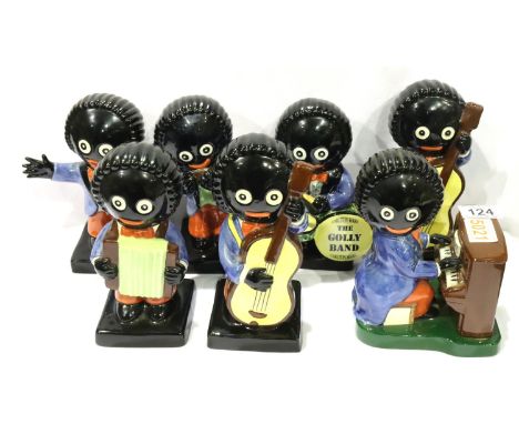 Seven ceramic Robertsons Jam Carlton Ware Golly band members, mostly limited editions H: 22 cm. No cracks, chips or visible r