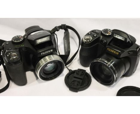 Two Fujifilm FinePix Cameras;- Finepix S2800HD 14Mp, 18 x zoom and Finepix S5700, 7.1Mp, 10 x zoom. Both with batteries and m