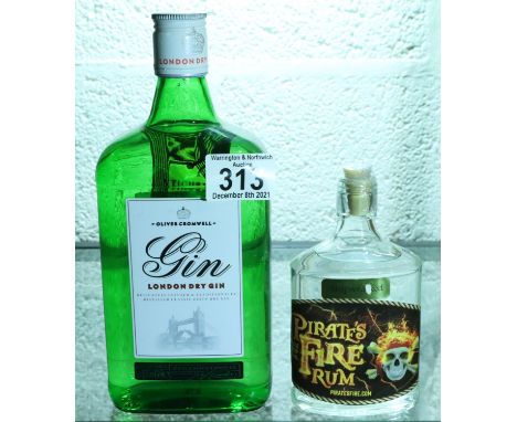 70cl bottle of Gordons gin and a small bottle of Pirates Fire rum, 130 proof. P&amp;P Group 3 (£25+VAT for the first lot and 