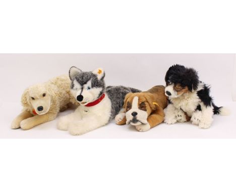 Steiff: A collection of four Steiff dogs to comprise References: 104954, 660184, 031755 and 036576. Three have yellow tags in