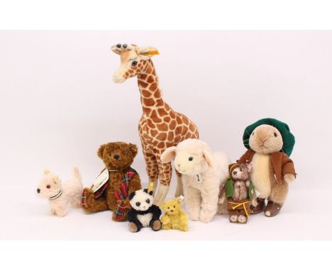 Steiff: A collection of eight various Steiff animals and bears including: Giraffe, Panda, Benjamin Bunny, Scotty and others. 