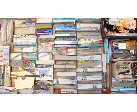 Model Kits: A collection of assorted boxed and unboxed model kits, mostly ships, plastic and metal, in varying condition. Ple