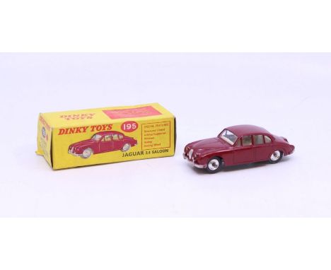 Dinky: A boxed Dinky Toys, Jaguar 3.4 Saloon, red body with lemon interior, Reference 195. Original box with correct colour s