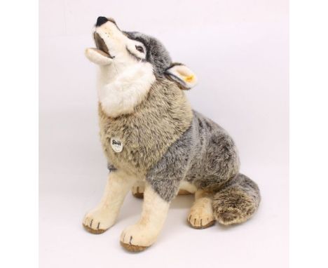 Steiff: A Steiff 'Snorry' Wolf, Reference 075759, yellow tag in ear, and tag attached to chest. height approx. 64cm. Generall