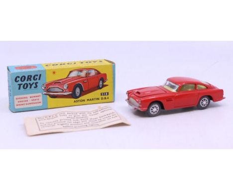 Corgi: A boxed Corgi Toys, Aston Martin D.B.4, red body with lemon interior, Reference 218. Original box, general wear expect