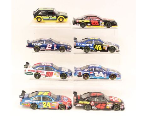 Diecast: A collection of seven assorted 1:18 scale diecast vehicles to include: Action, and Motorsport Authentics; unboxed. T