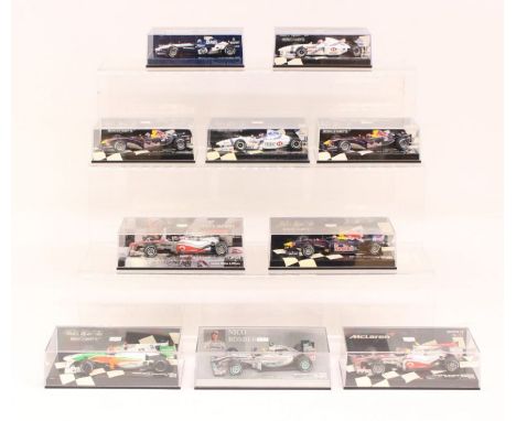 Minichamps: A collection of ten cased Paul's Model Art Minichamps 1:43 Formula 1 and other race vehicles of varying design. S