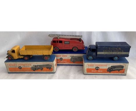 Dinky: A collection of three boxed Dinky Toys vehicles to comprise: Guy Van Lyons Swiss Rolls, 514, some playwear; Fire Engin