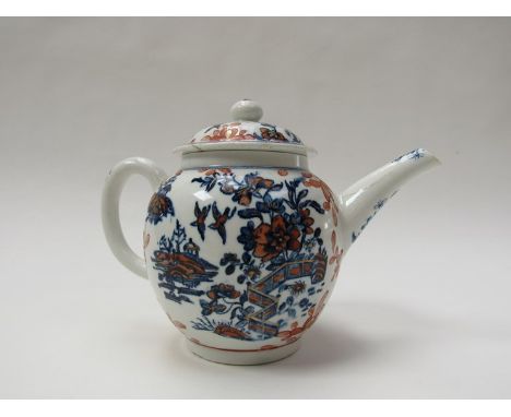 An 18th Century Lowestoft teapot and cover of bullet shape, blue and white underglaze of pagodas, birds and flowers, heighten