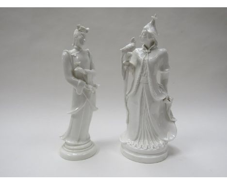 Two Royal Worcester style all-white china figures of Mandarin ladies, one holding a tamed exotic bird, 32cm x 31cm tall, unma
