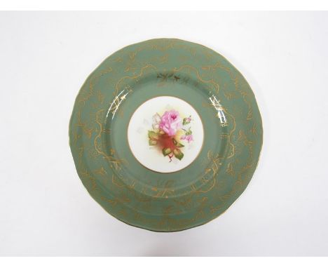 A Royal Worcester bone china dinner-sized cabinet plate, centrally painted with pink roses by A. Davis, within a broad green 