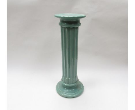 A reeded turquoise glazed ceramic jardiniere stand, 54cm tall