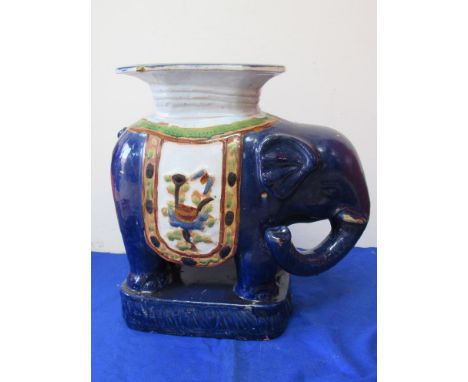 A pair of blue ceramic elephant jardinere stands