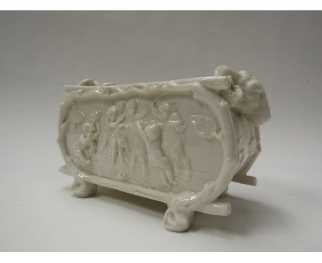 A Royal Worcester all-white porcelain rustic planter, moulded with merry-making cherubs. Impressed crowned wheel mark, 20cm w