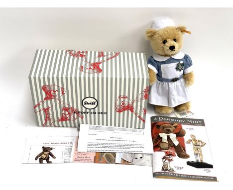 A boxed Danbury Mint Steiff 'Bear Who Cares', with tags and original papers 