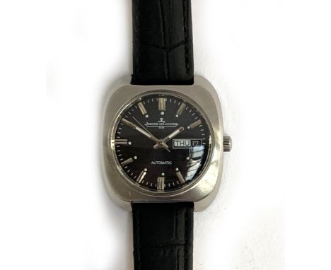 A Jaeger leCoultre Club stainless steel day date automatic gent's wrist watch, with baton numerals on a black dial, 36mm diam