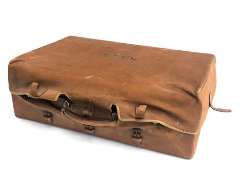 A vintage leather suitcase with fitted canvas cover, monogrammed WFLN, the green interior with fitted compartments, with key,